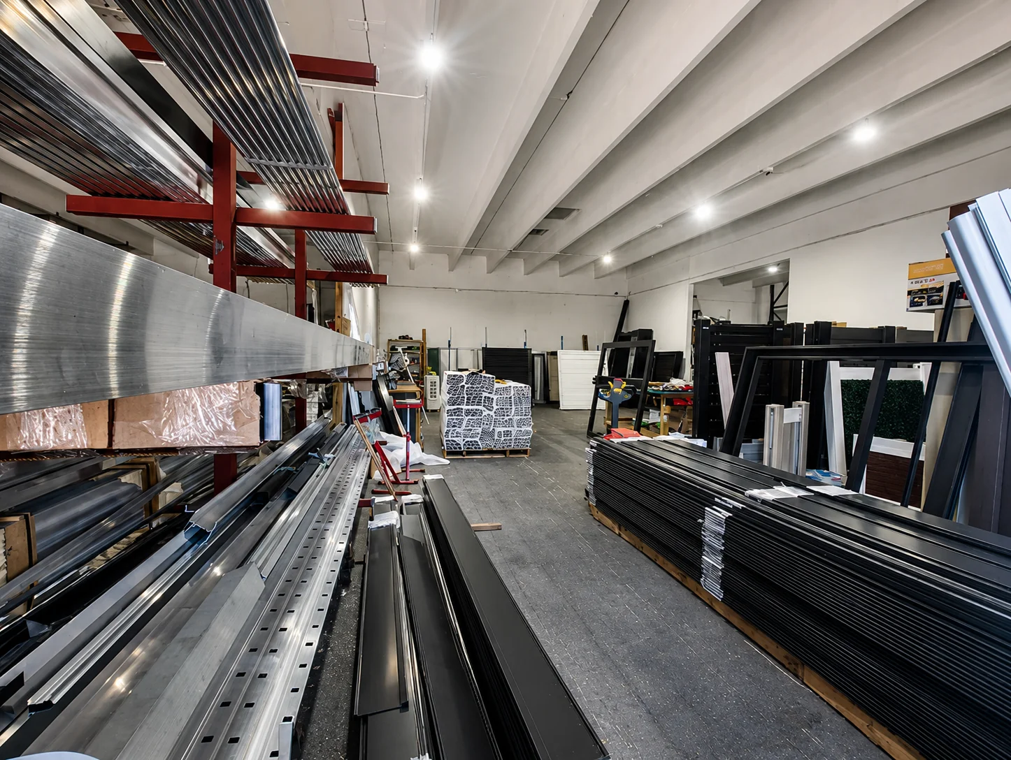 Bulk PVC fence inventory at Elite PVC Florida warehouse - exclusive distributor of All Season Fencing Ltd.