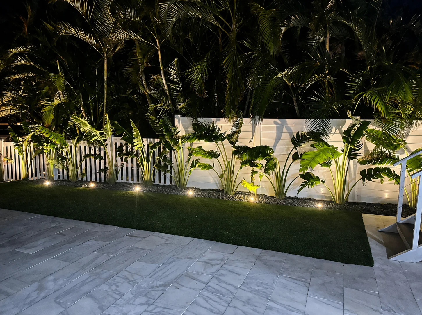 PVC fence installation in Miami, Florida - white PVC privacy and picket fence with landscape lighting by Elite PVC fencing