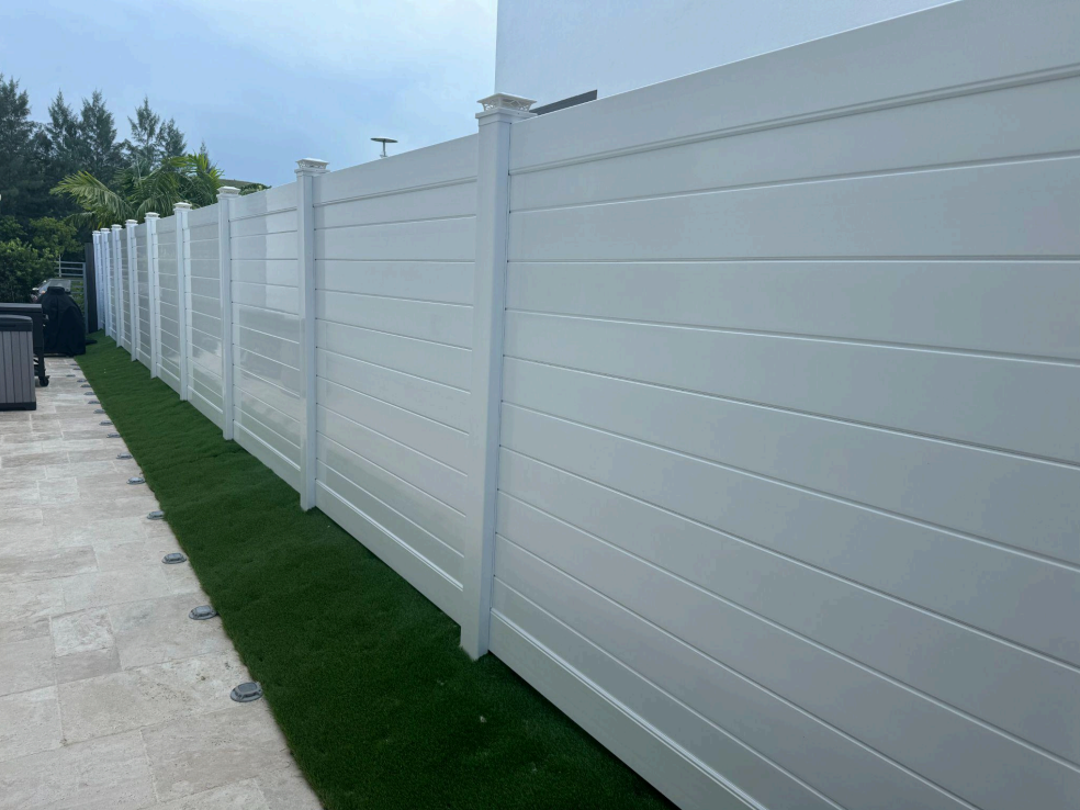 White vinyl privacy fence installation in Southeast Florida