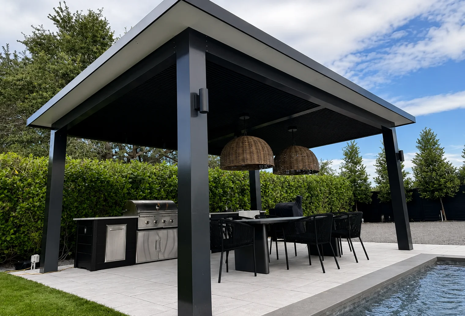 Luxury aluminum pergola with custom outdoor kitchen and poolside patio in Southeast Florida - Elite PVC