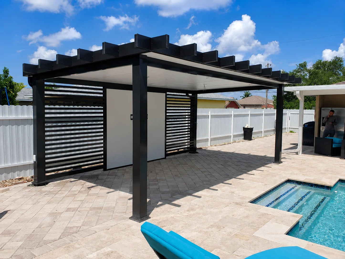 Modern covered pergola patio design with dining area and grill station in Southeast Florida - Elite PVC