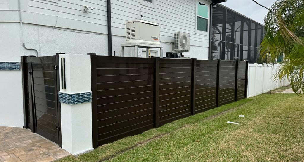 Vinyl fence with concrete wall